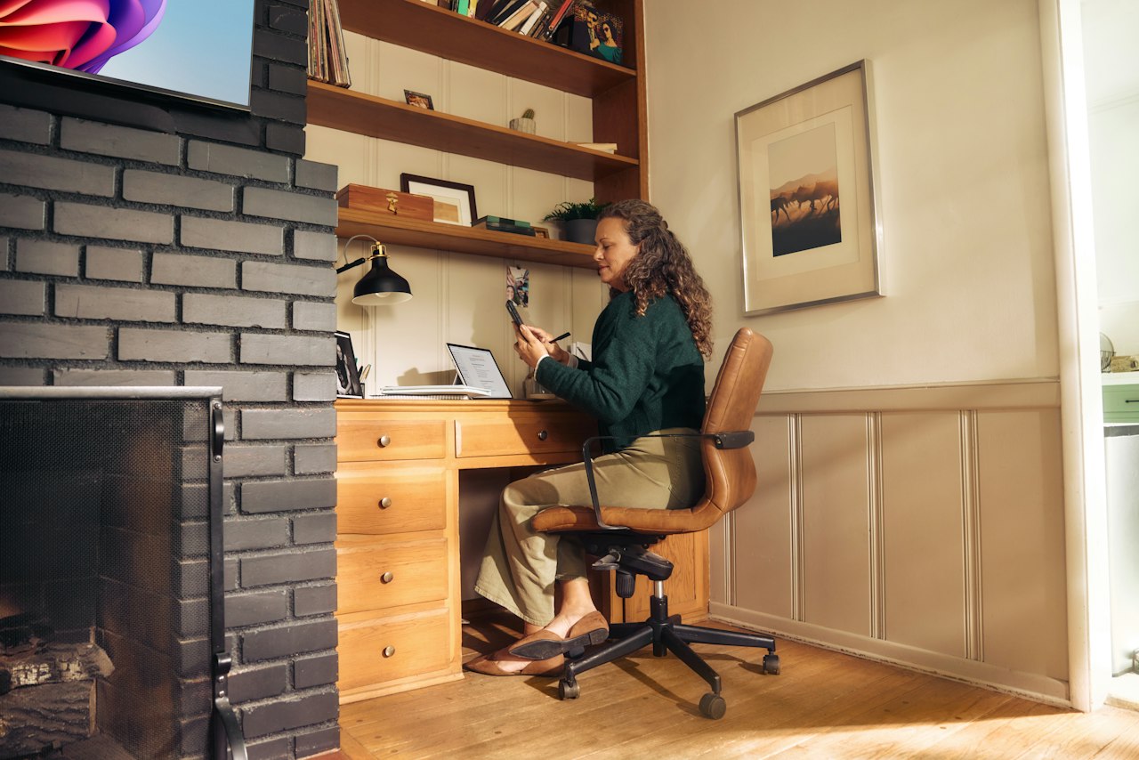 A sole trader working through her return at a home-office desk